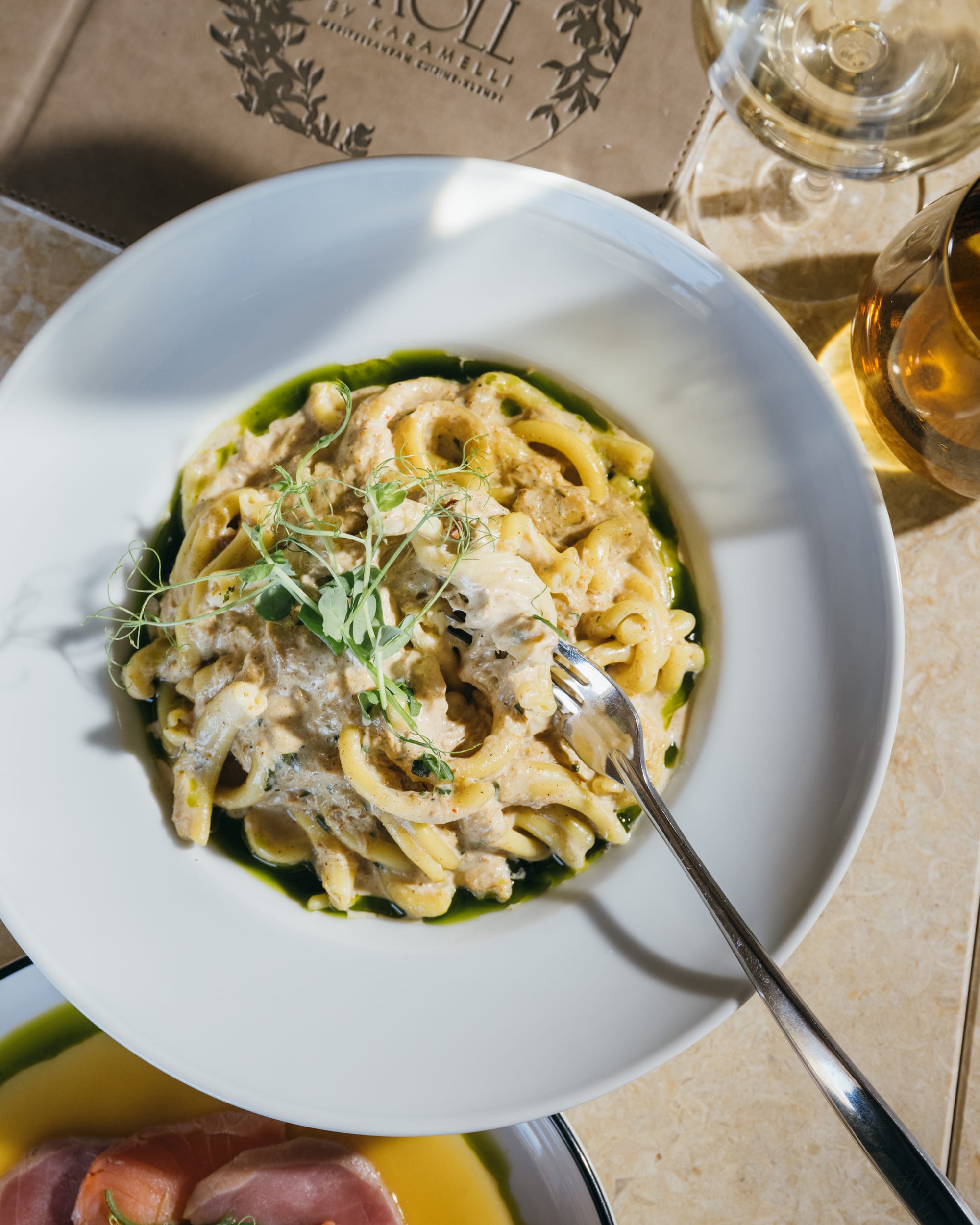 Creamy seafood pasta with basil oil