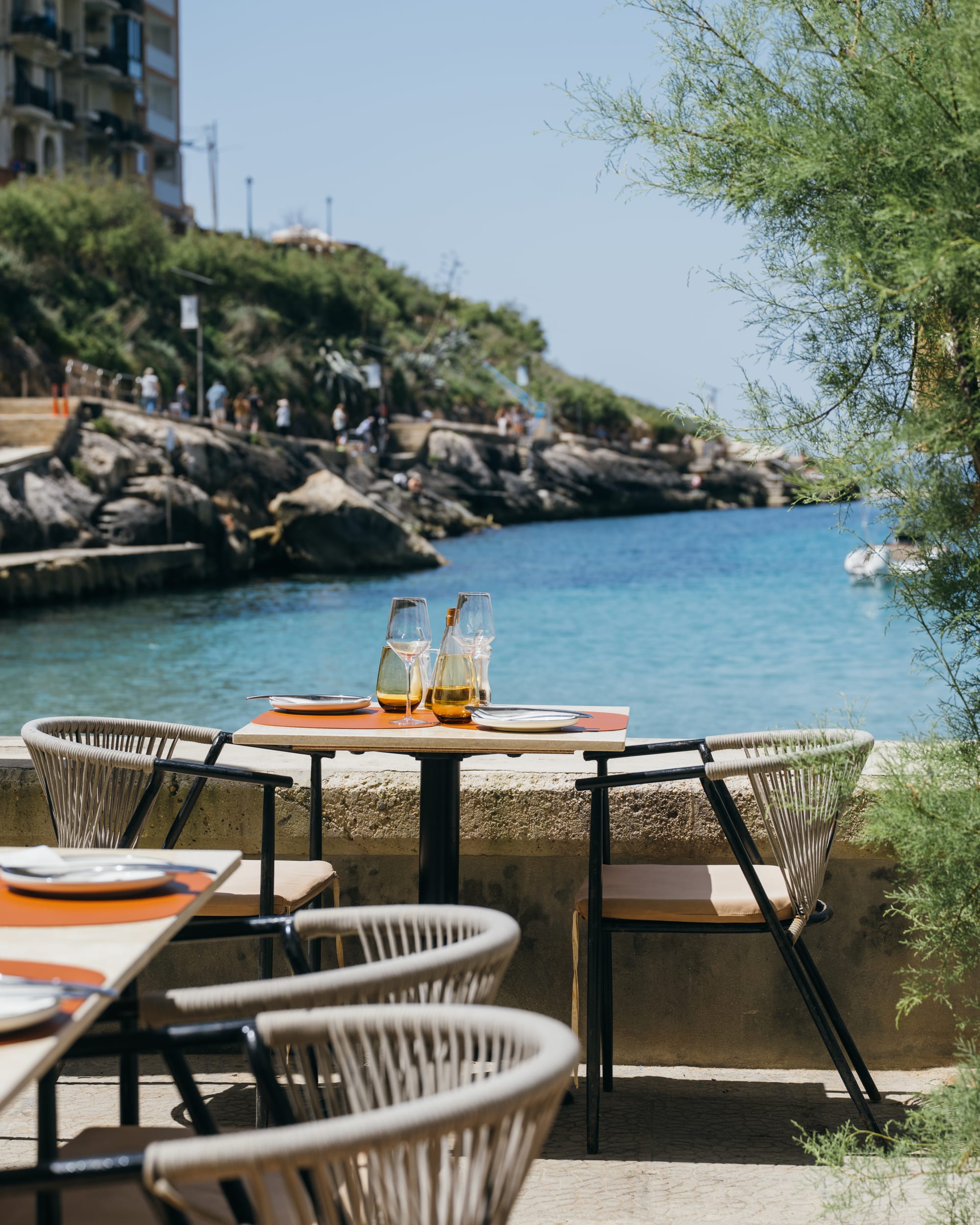 Tables on the Xlendi waterfront
